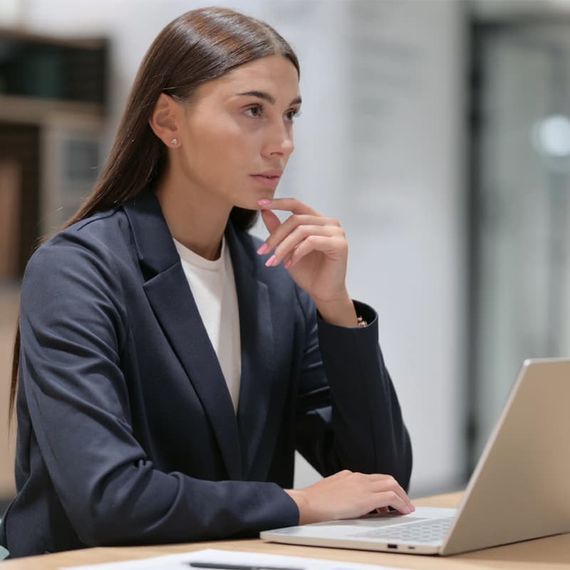 Thinking Latin Businesswoman Working in Office.