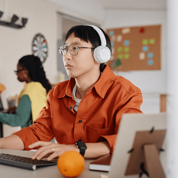 Neurodivergent professional working with headphones