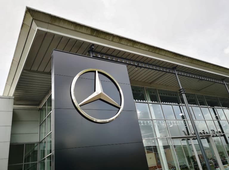 Mercedes showroom with logo. Mercedes-Benz, commonly referred to as Mercedes is known for producing luxury vehicles and commercial vehicles. The headquarters is in Stuttgart, Baden-Württemberg.