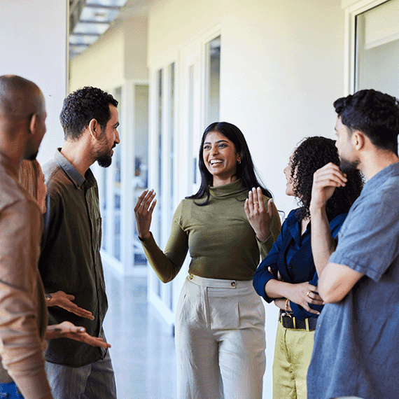 Group of coworkers looking happy at work