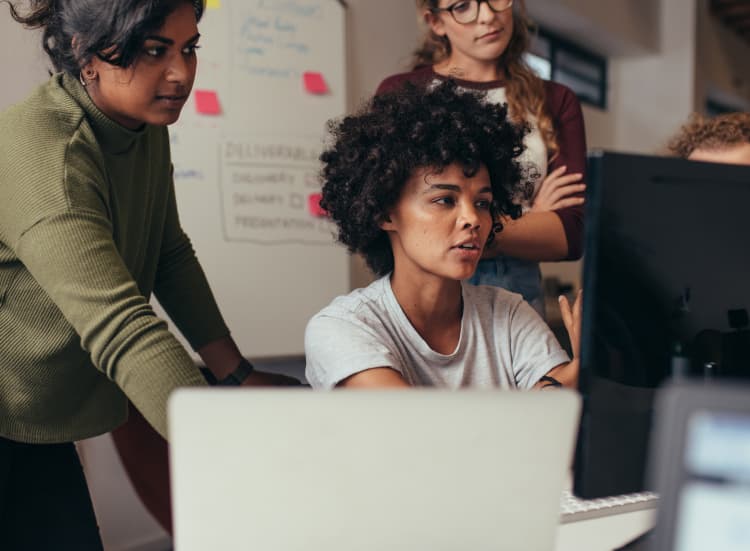 People looking at a computer