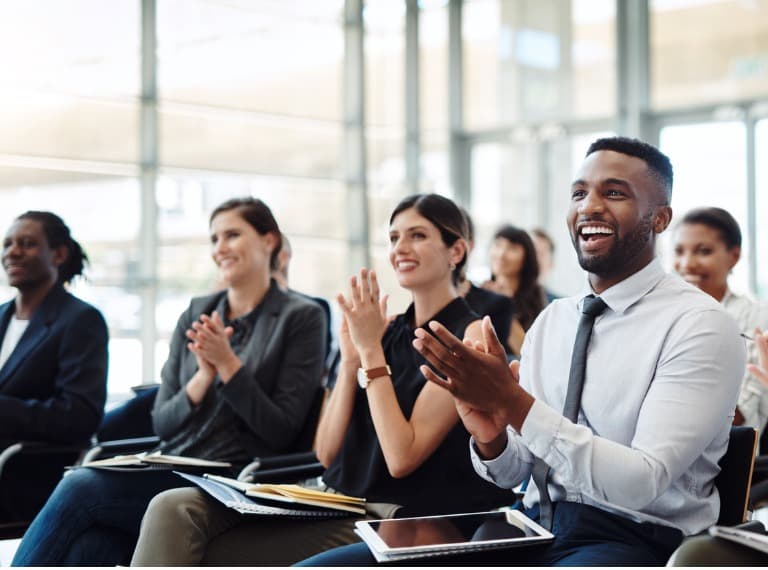 Office workers applauding